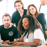 woman-sharing-her-presentation-with-her-colleagues-3153198